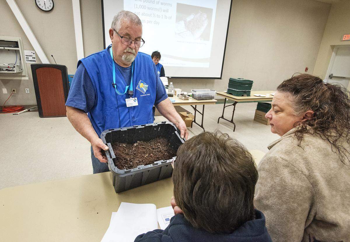 Master gardener Ted Hawkins shows MaryKate and Carol Cook of Oakdale the worm bin he assembled during a University of California Cooperative Extension class on raising worms to consume food scraps in Modesto, Calif., Thursday, Nov. 14, 2019.