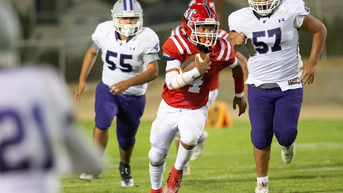 Modesto Christian’s Raymond Corral Jr. runs the ball during the non-league game with Denair at Modesto Christian High School in Salida, Calif., on Friday, August 26, 2022. Modesto Christian won the game 47-29.