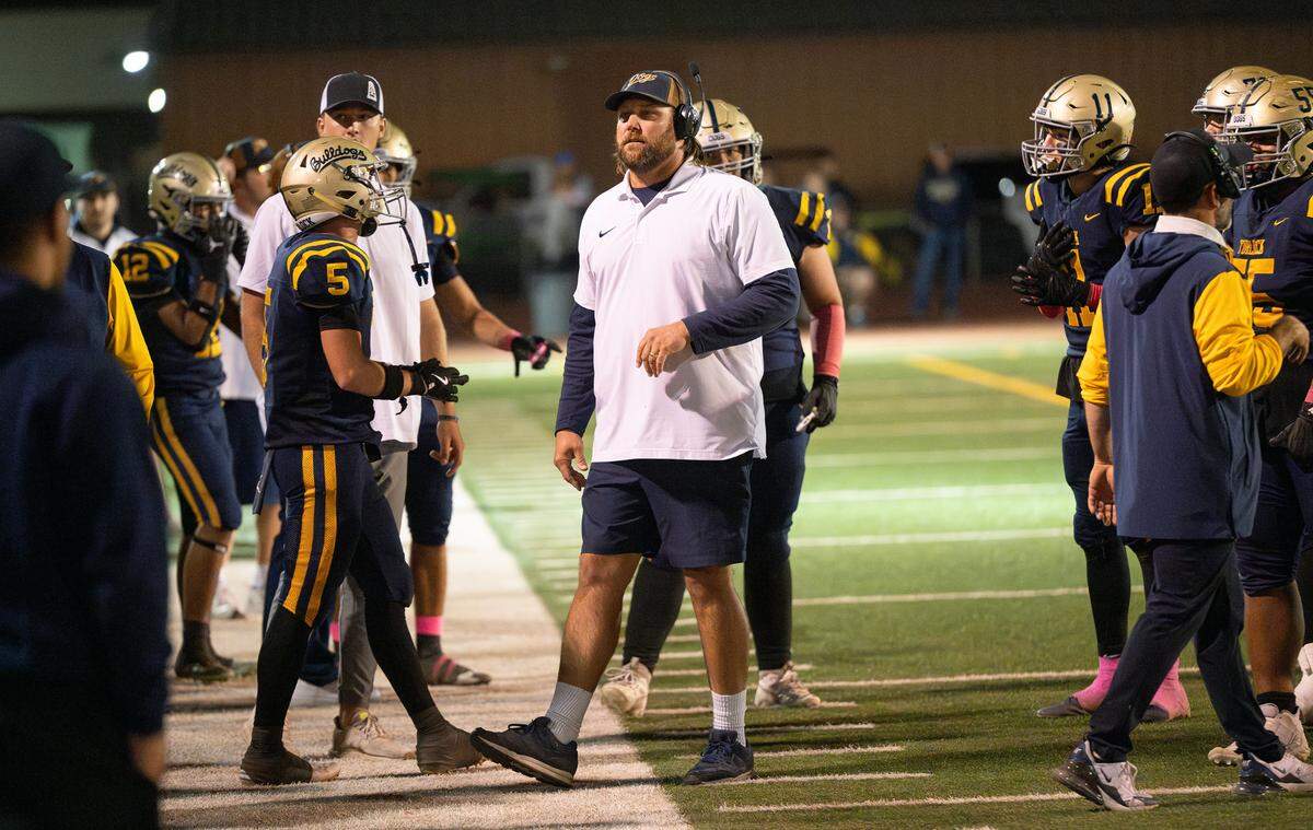 Turlock coach James Peterson talks to his team during a break in the Central California Athletic League game at Turlock High School in Turlock, Friday, Oct. 18, 2024.