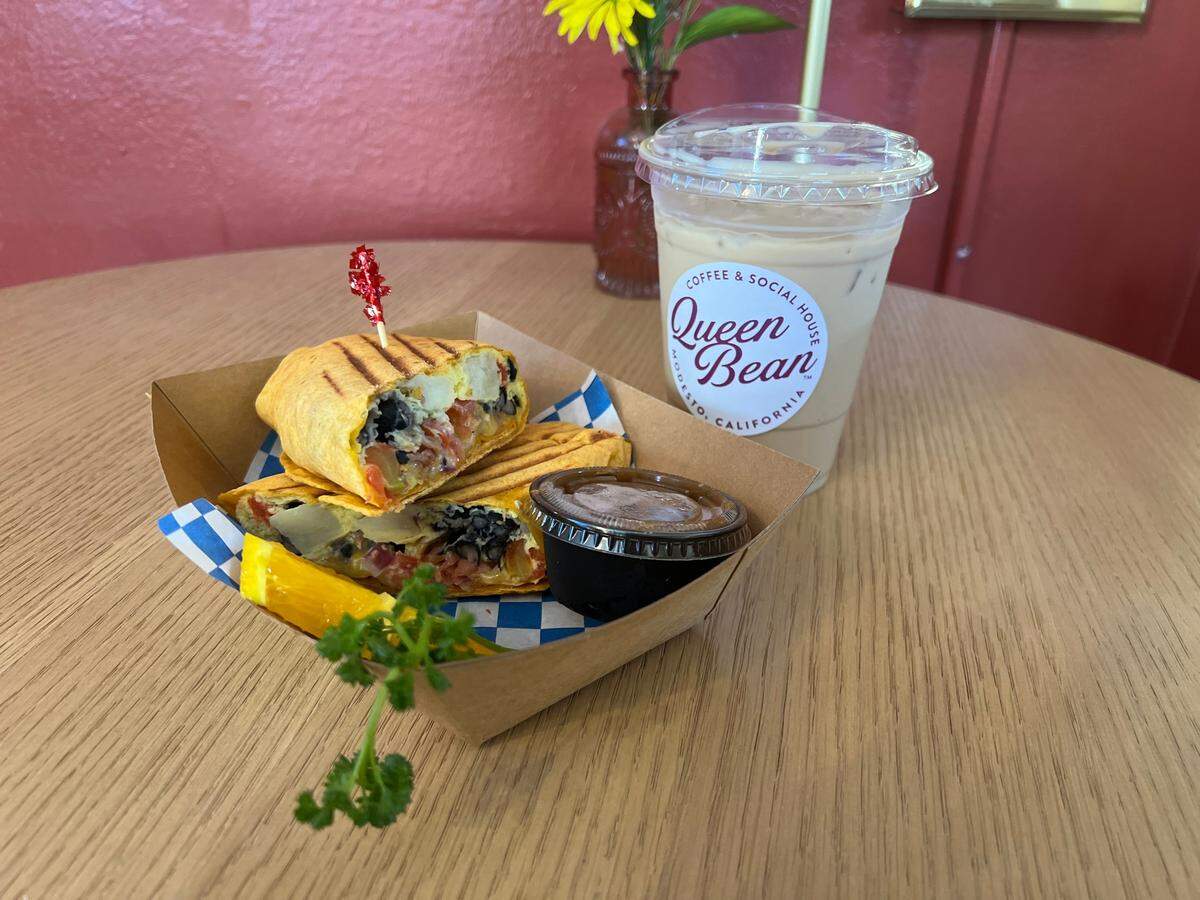 During my trip to Queen Bean Coffee and Social House, I got a breakfast burrito and iced coffee for $19.74.