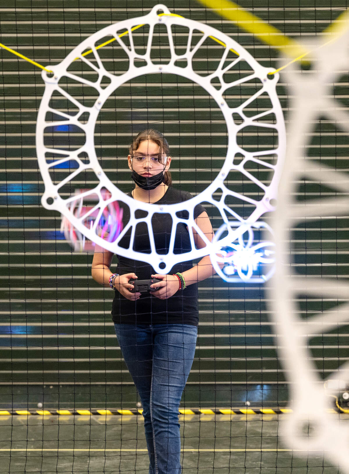 Xitlali DeLaCruz, 11, flies a drone during Drone Soccer camp at Modesto Junior College in Modesto, Calif., on Friday, June, 24, 2022.