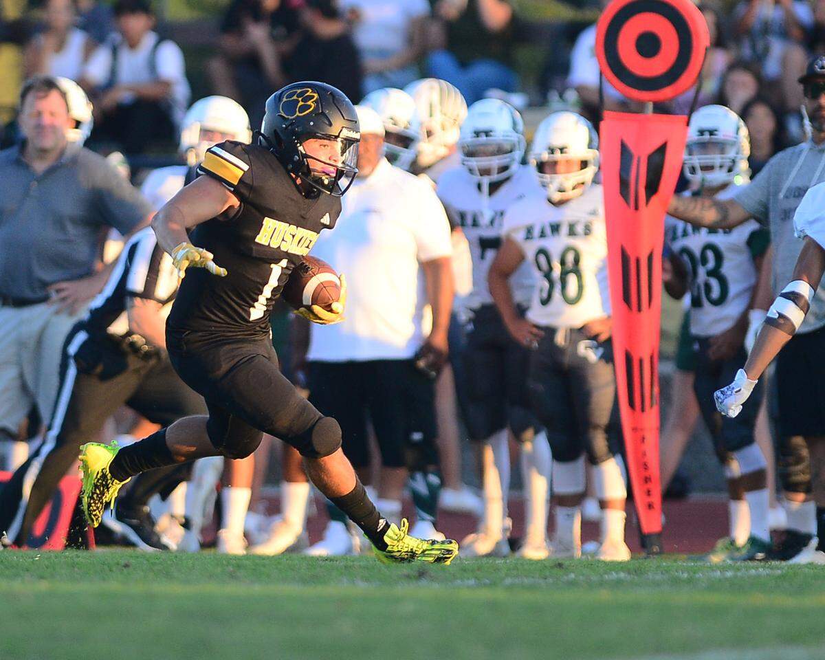 Hughson running back Alexander Villarreal cuts back during a game between Hughson High School and Central Valley High School at Hughson High School in Hughson California on August 25, 2023.