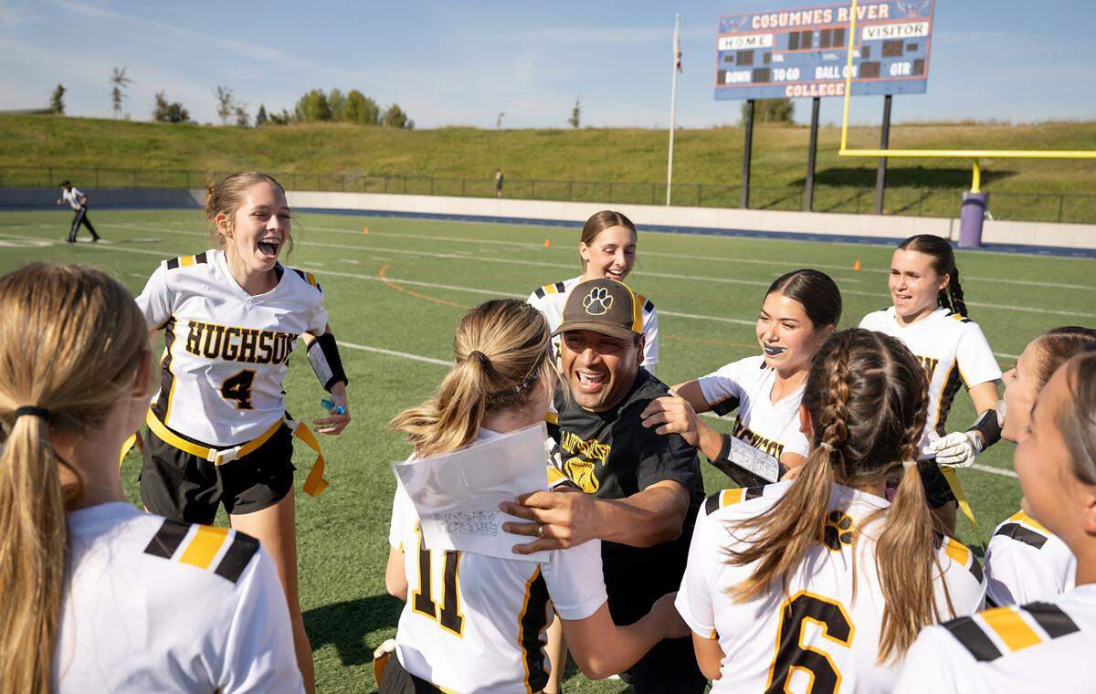 Hughson coach Charly Garza celebrates the Sac-Joaquin Section Division 4 championship victory over Colfax with his team at Cosumnes River College in Sacramento, Saturday, Nov. 9, 2024. Hughson won the game 26-13.