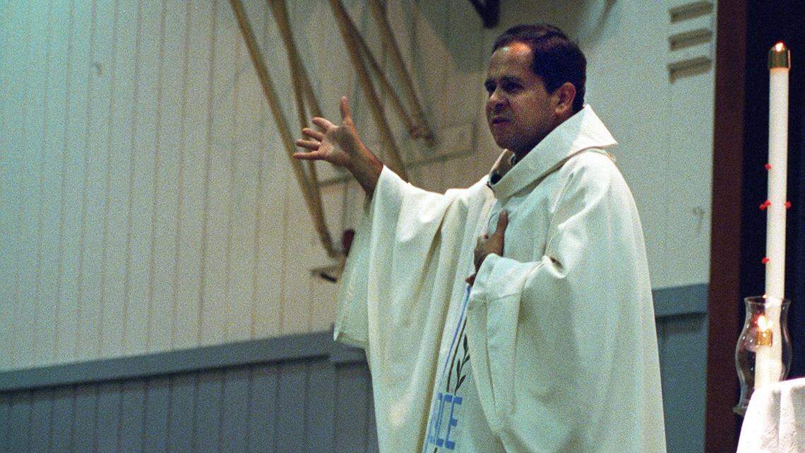 Former St. Stanislaus Catholic Church priest Eduardo Perez is seen here in April 2002 conducting services in Spanish on Easter Sunday at the St. Stanislaus School gymnasium.