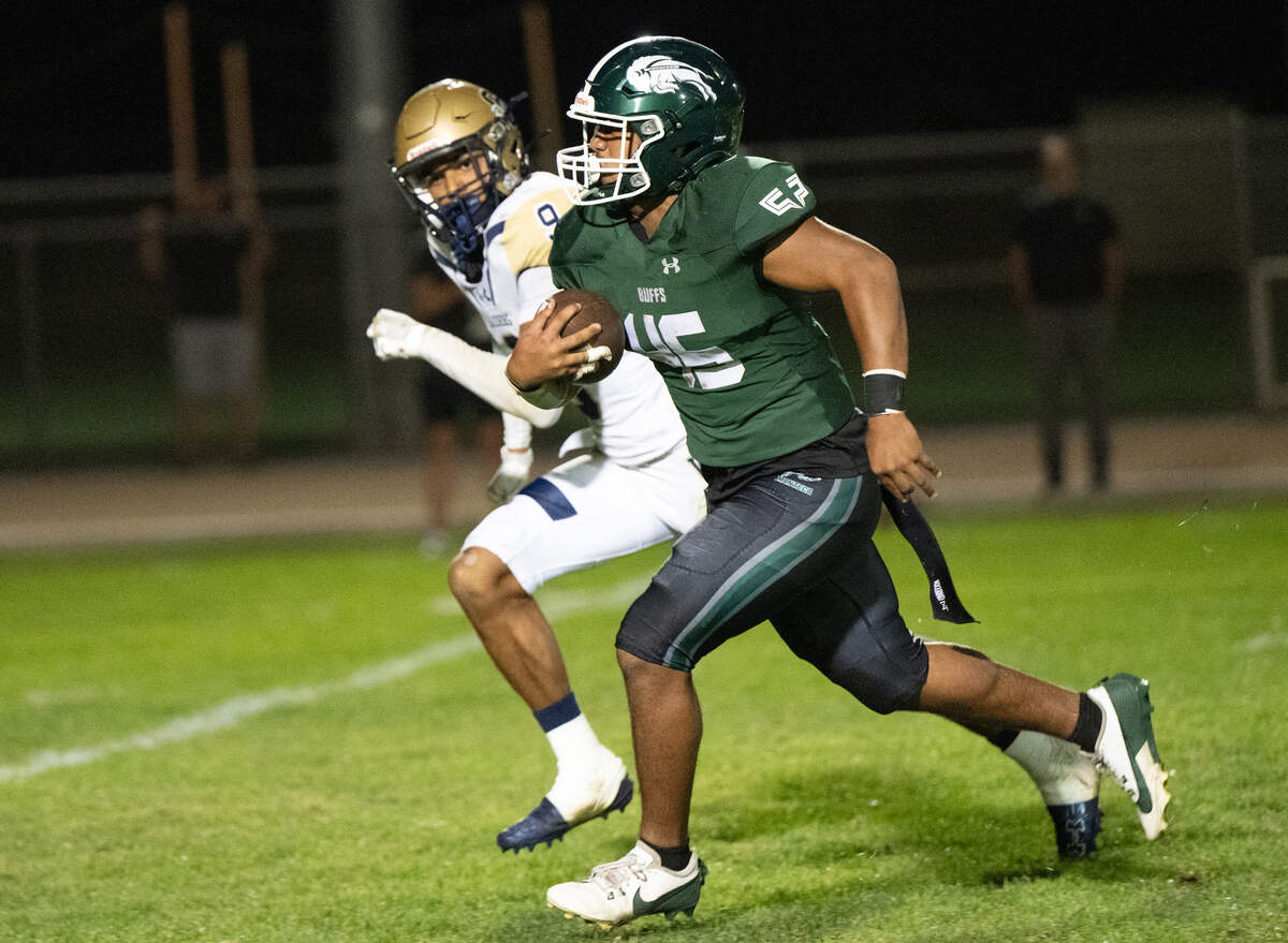 Manteca’s Maava Tialavea breaks out on the run during the Valley Oak League game with Central Catholic at Lathrop High School in Lathrop, Calif., Friday, Sept. 27, 2024. Manteca won the game 31-14.