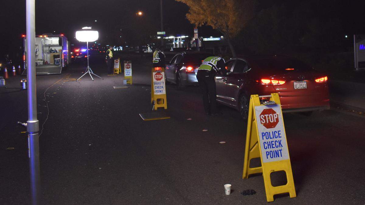 Modesto police conduct a driver’s license and DUI checkpoint on Oakdale Road in front of the VA clinic on Nov. 30, 2018.