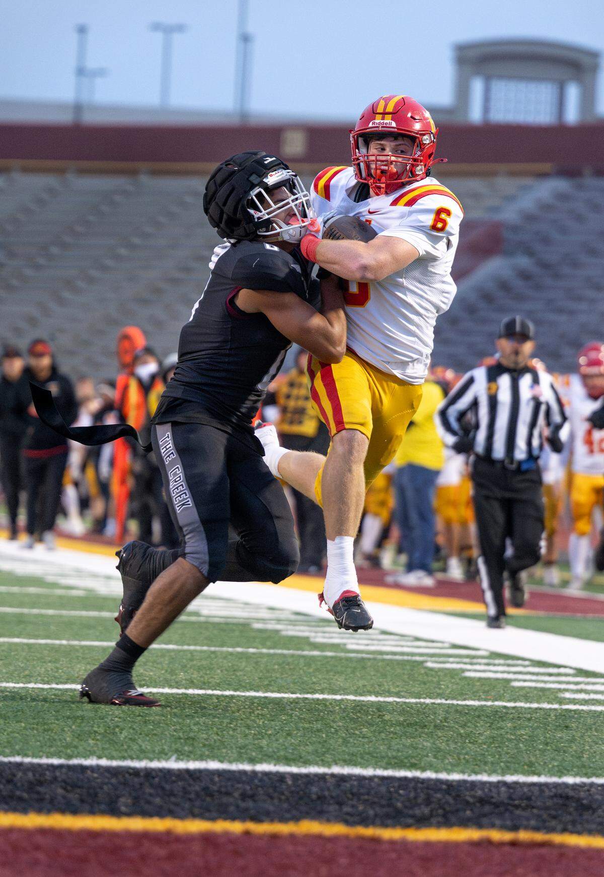 Woodcreek’s Trace Murchison forces Oakdale’s Chase Lopez out of bounds during the Sac-Joaquin Section Division III championship football game at Hughes Stadium in Sacramento. Lopez ran for 71 yards in the game.