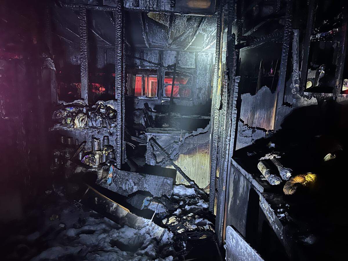 The interior of the Oakdale mobile home shows extensive fire damage following the late-night blaze. The cause remains under investigation.