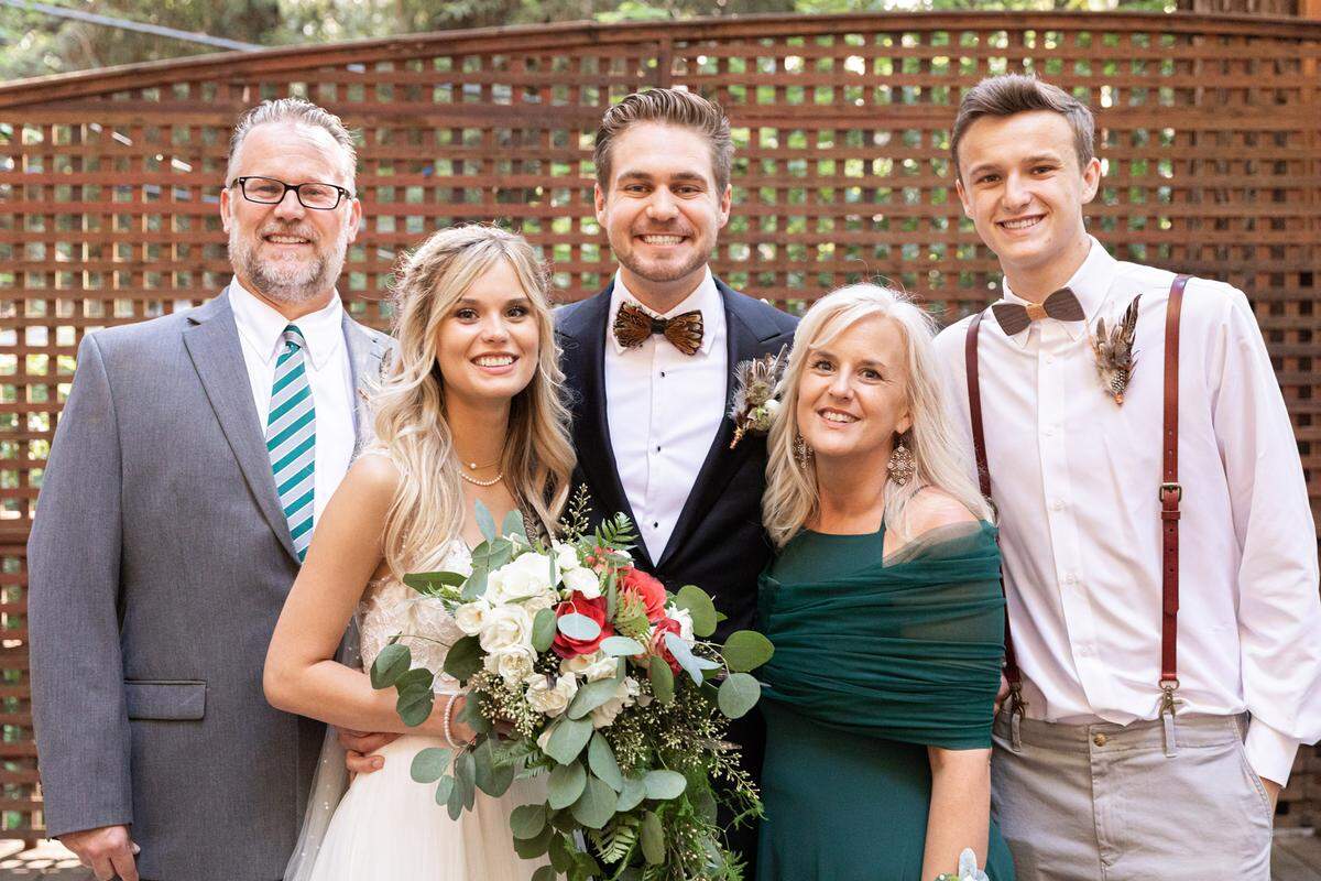 Father Bryan Christenson, Ash Ruder, husband Dylan Ruder, mother Julie Christenson, and brother Adam Christenson