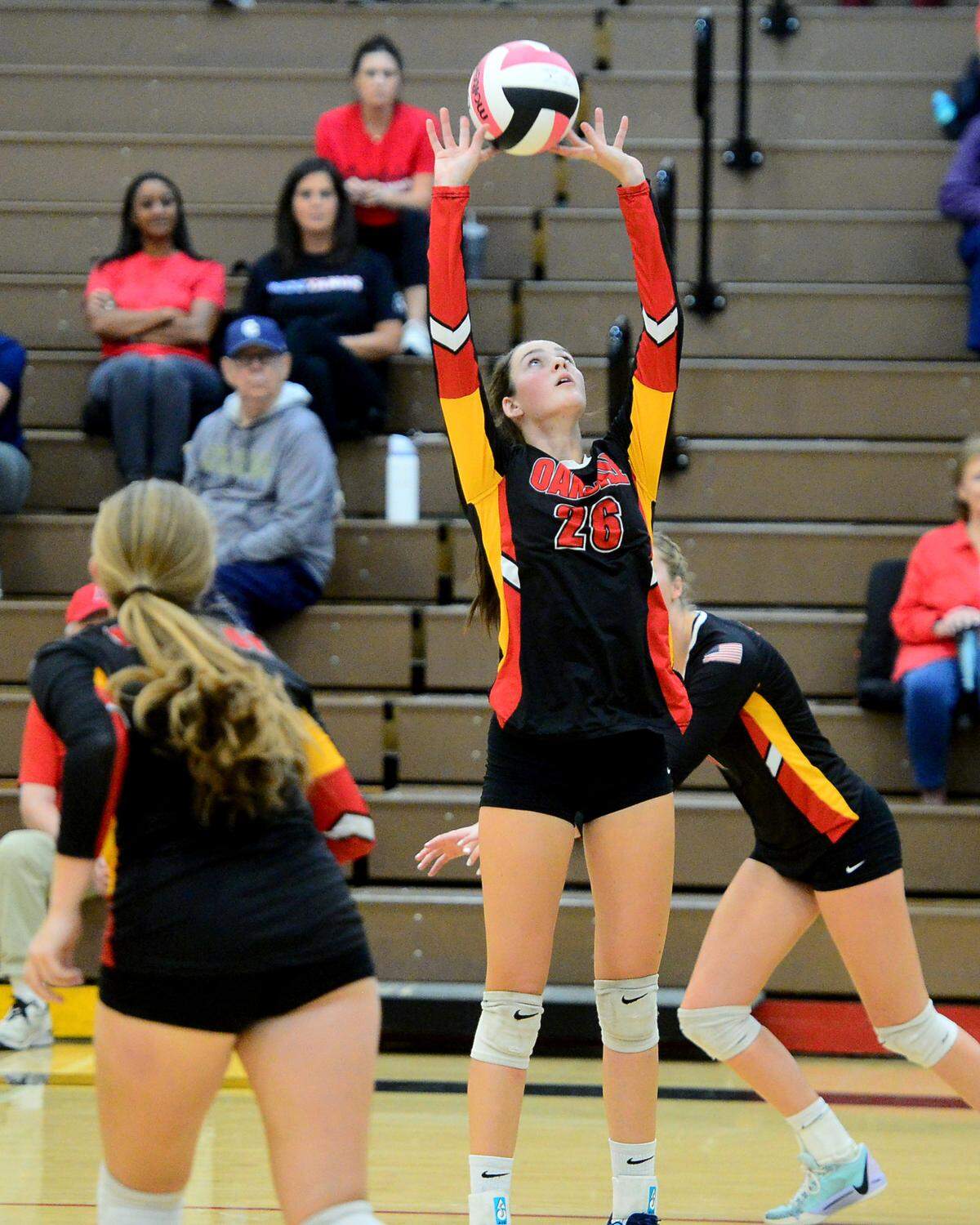 Oakdale’s Jaedyn Riley (26) sets the ball during a game between Oakdale and Central Catholic at Oakdale High School in Oakdale, Calif. on Thursday, Oct. 17, 2024.&nbsp;