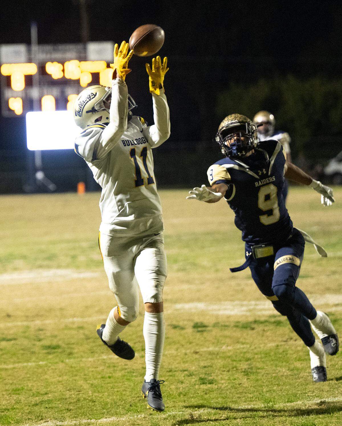 Turlock’s Landyn Fitzgerald makes a touchdown reception past Central Catholic’s Scotty Hallmon during the Sac-Joaquin Section Division I playoff game at Central Catholic High School in Modesto, Friday, Nov. 15, 2024.