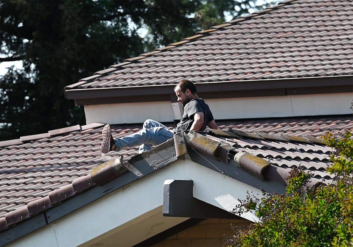 A man was arrested after climbing on the roof of the Church of Jesus Christ of Latter-Day Saints church on Dale Road in Modesto, Calif., on Tuesday, April 26, 2022. The man ripped up and destroyed dozens of tiles on the church roof.