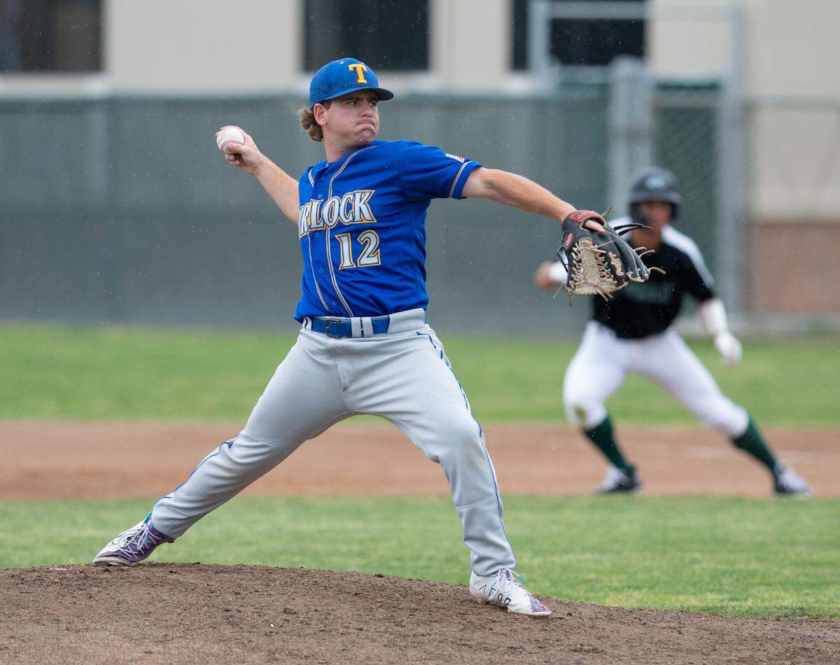 Turlock’s Boston Souza throws out the stretch during the Central California Athletic League game with Pitman at Pitman High School in Turlock, Calif., on Thursday, April 14, 2022.