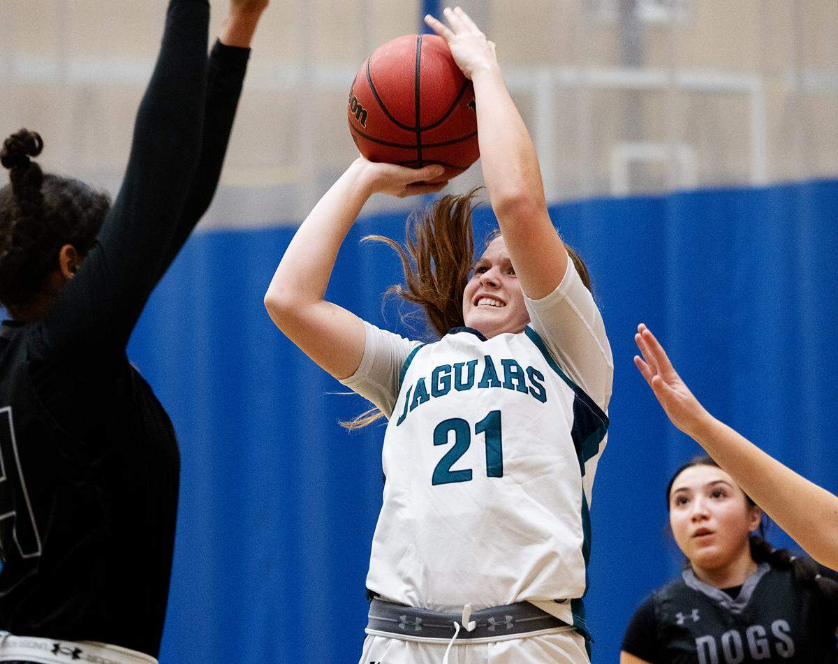 Gregori’s Audrey Pacheco takes a shot under pressure from a Tracy defender at Gregori High School in Modesto, Calif., Friday, Dec. 8, 2023.