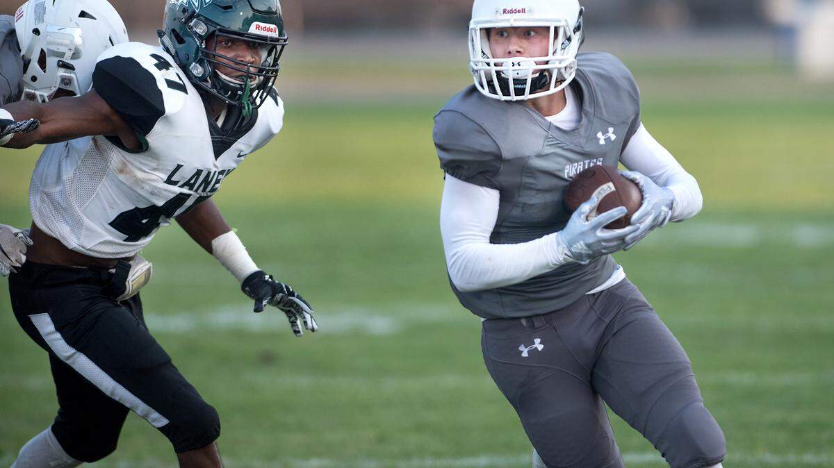 Modesto’s Kane Rodgers makes a gain after a catch during Saturday’s game with Laney College at Modesto Junior College in Modesto, Calif., September 1, 2018. 