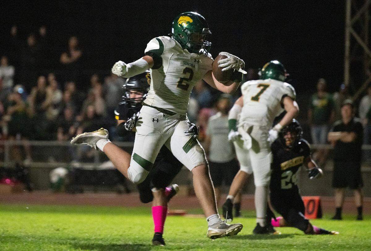 Sonora’s Brody Speer runs in for a touchdown during the Trans Valley League game with Hughson in Hughson, Friday, Oct. 11, 2024.