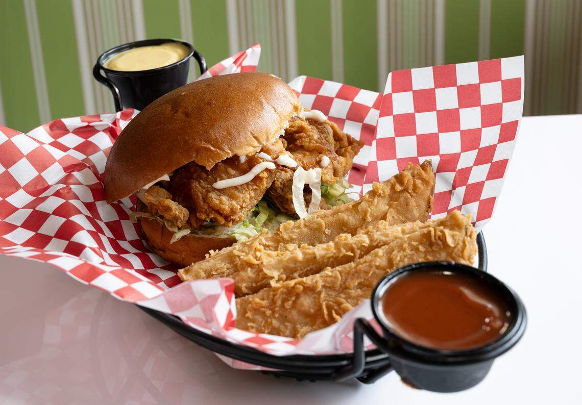 Chicken sandwich and potato wedges or “spuds” with dipping sauce at Chicken Barn restaurant in Modesto, Calif., Thursday, Sept. 21, 2023.