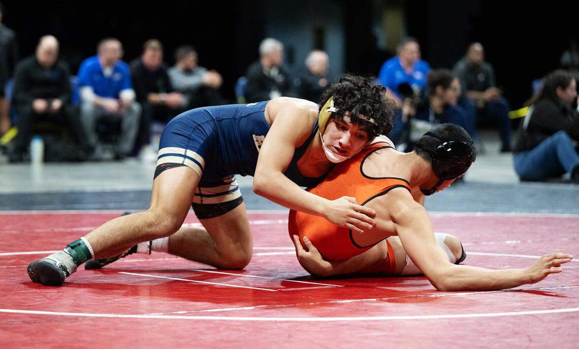Central Catholic’s Victor Gutierrez ties up Vacaville’s Ryan Espiritu during the Sac-Joaquin Section Masters Wrestling Championships at Stockton Arena in Stockton, Calif., Saturday, Feb. 17, 2024. Gutierrez won the 132-pound title 3-0.