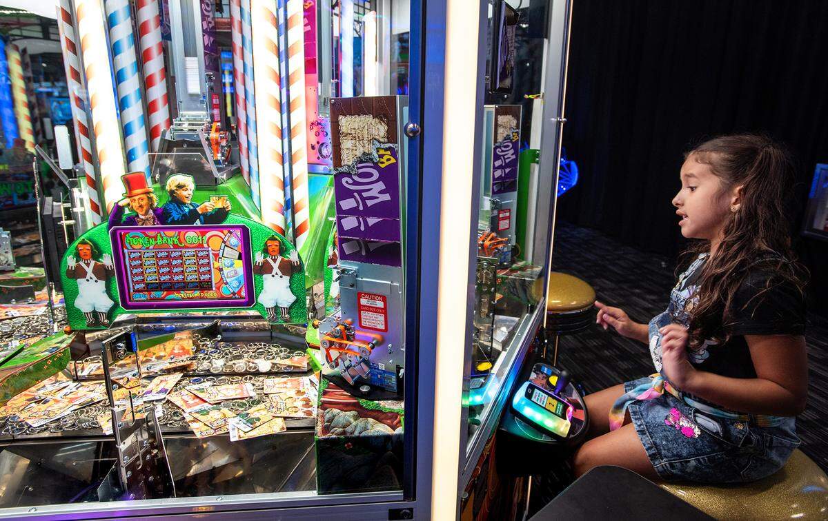 Aliyana Guzman, 5, plays a game at Dave & Buster’s entertainment center and restaurant in Vintage Faire Mall in Modesto, Calif., on Thursday, June 2, 2022.
