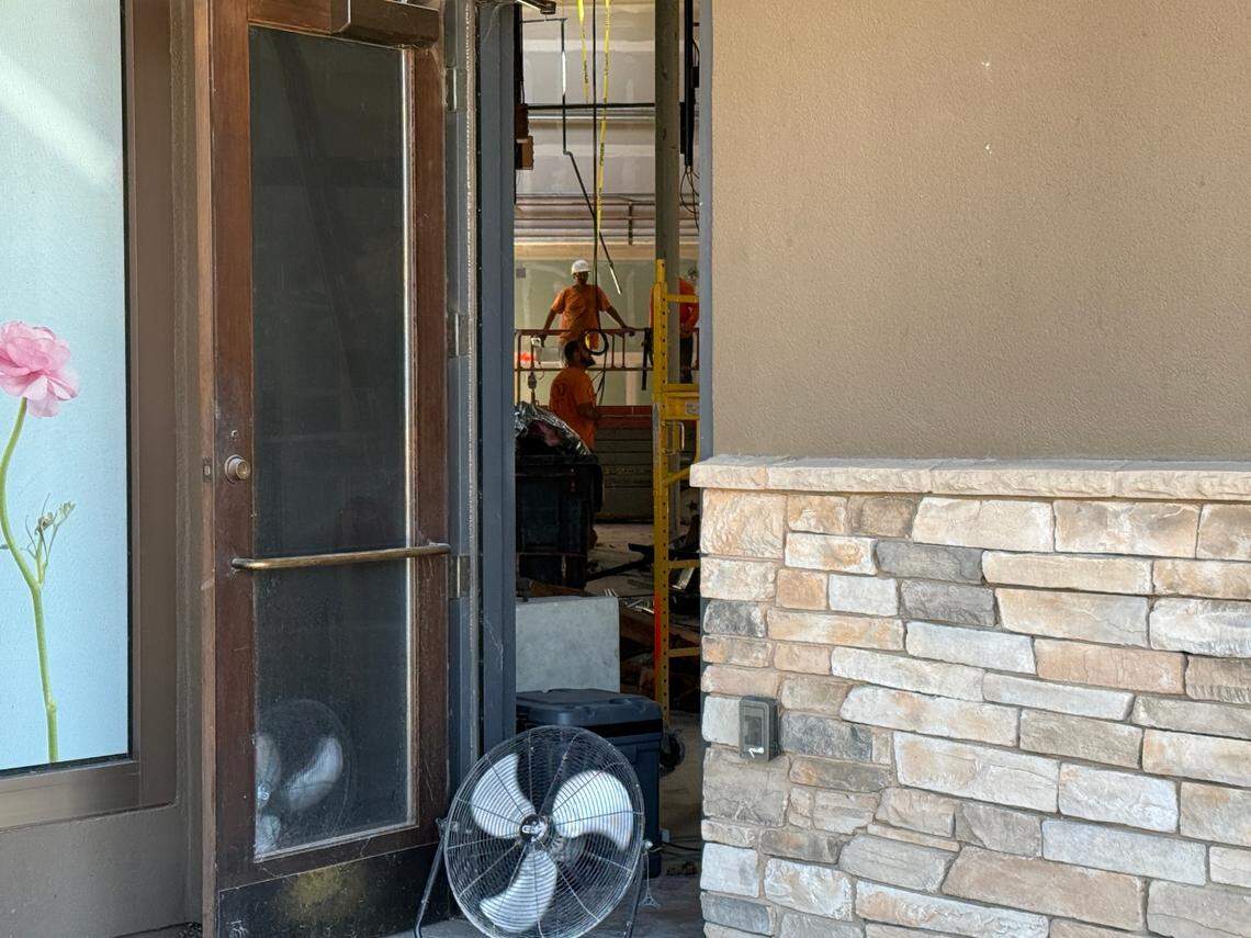A Central Valley Demolition crew working on gutting the interior of the former Fire Bar & Grill site at the Vintage Faire Mall in Modesto, Calif., on July 10, 2025.