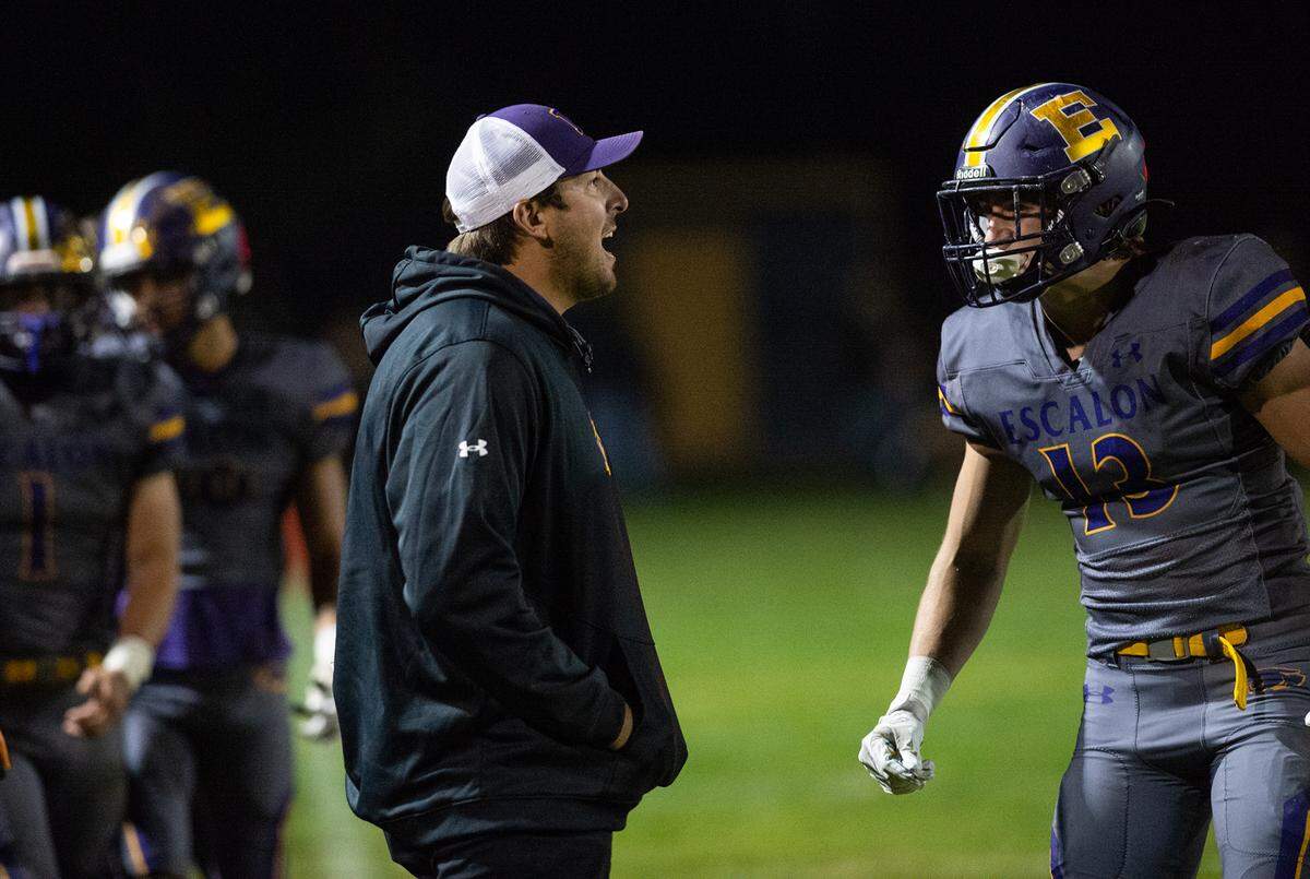 Escalon head coach Andrew Beam calls out to his players during the first round playoff game with Pacheco in Escalon, Calif., Friday, Nov. 4, 2022.