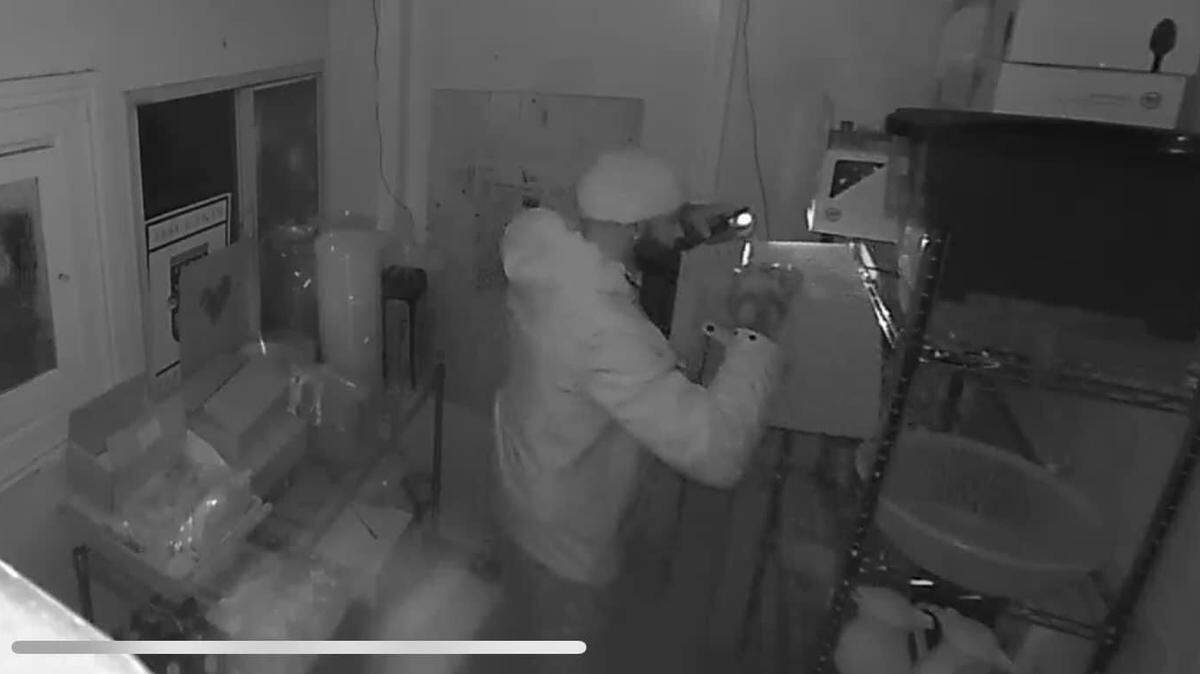 Surveillance cameras captured images of the suspect in a theft at Queen Bean Coffee & Social House on Saturday night.