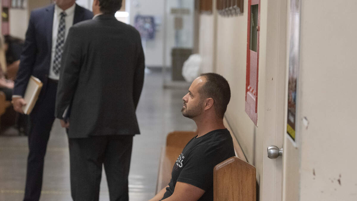 David Odom sits in the hallway outside a Stanislaus County Superior Court courtroom Thursday in Modesto as attorneys prepare for his preliminary hearing. Odom was ordered to stand trial on two felony sex crime charges.