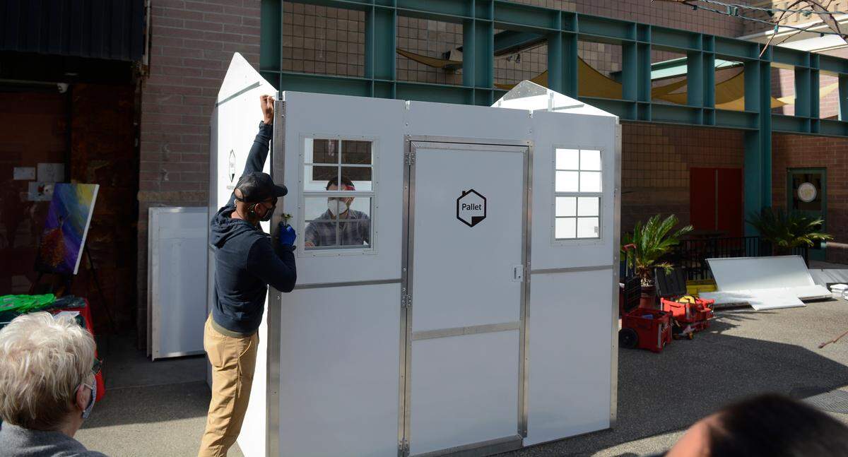 Pallet Shelter, a Washington-based company, built one of its 100-square-foot shelters on Tuesday, March 2, 2021 in Modesto, California. The shelters can be built in 30 minutes and are temporary housing for the homeless.