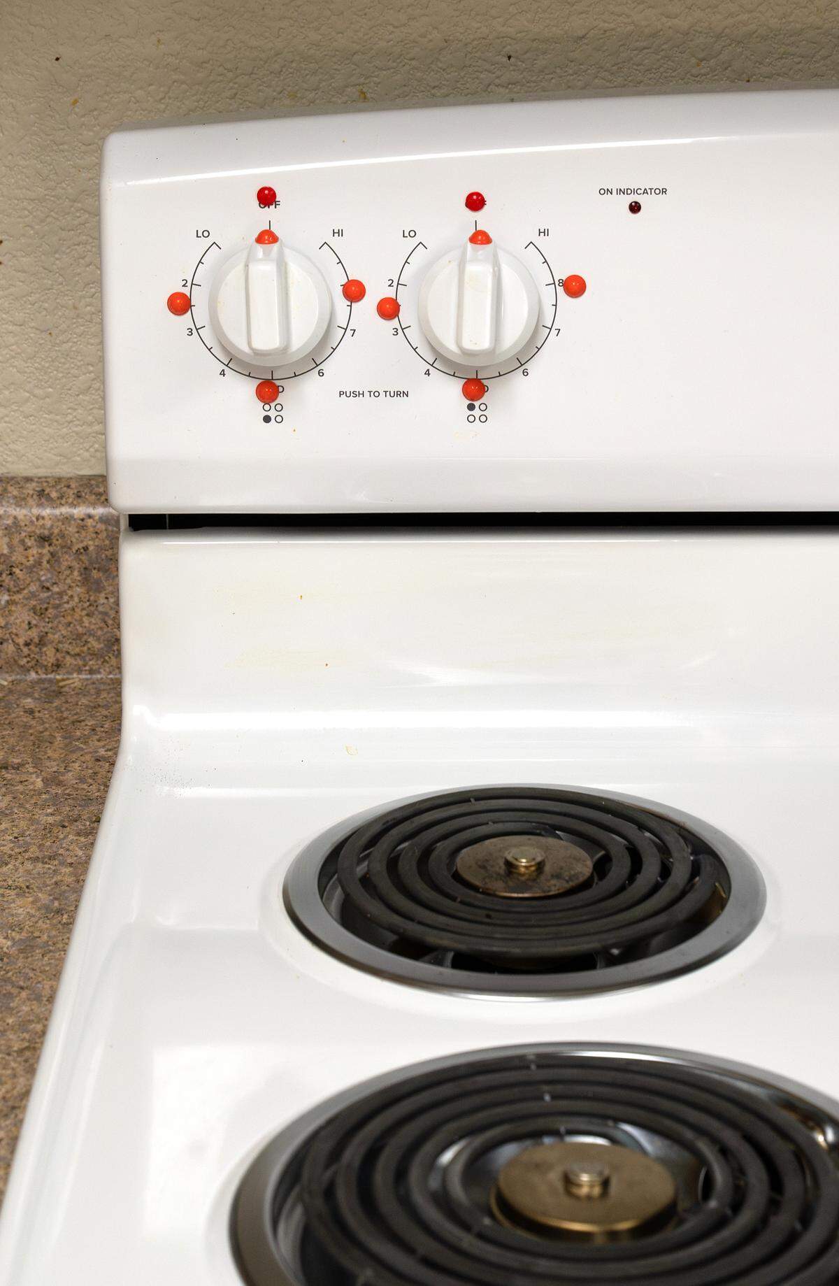 A stove at the VIPS training center has bump dots for a visually impaired person to use it in a tactile way.
