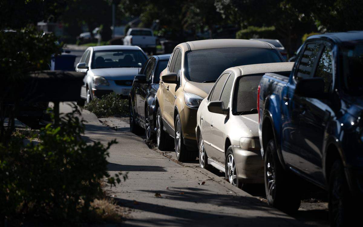 Cars are parked in a north Modesto neighborhood Friday, Oct. 6, 2023. 