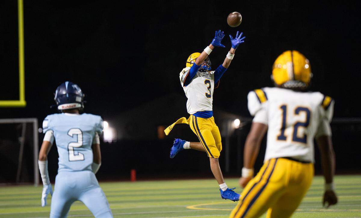 Turlock’s Noel Garcia makes a catch during the Central California Athletic League game with Downey at Downey High School in Modesto on  Friday, Oct. 24, 2025.