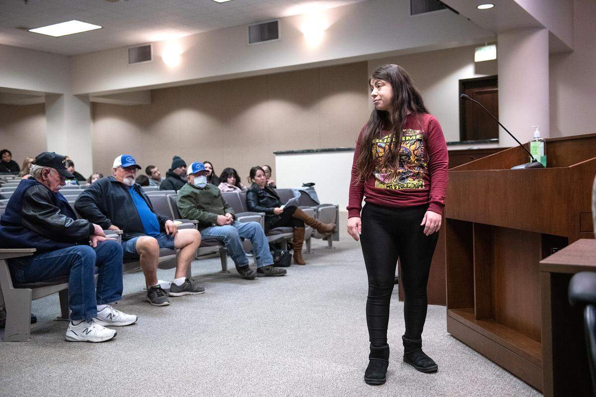 Alissia Hager, sister-in-law of Paul Chavez Jr., looks to the police chief as she speaks during public comment during the Modesto City Council meeting in Modesto, Calif., Tuesday, Dec. 13, 2022. Council members adopted recommendations from its Forward Together police oversight committee.