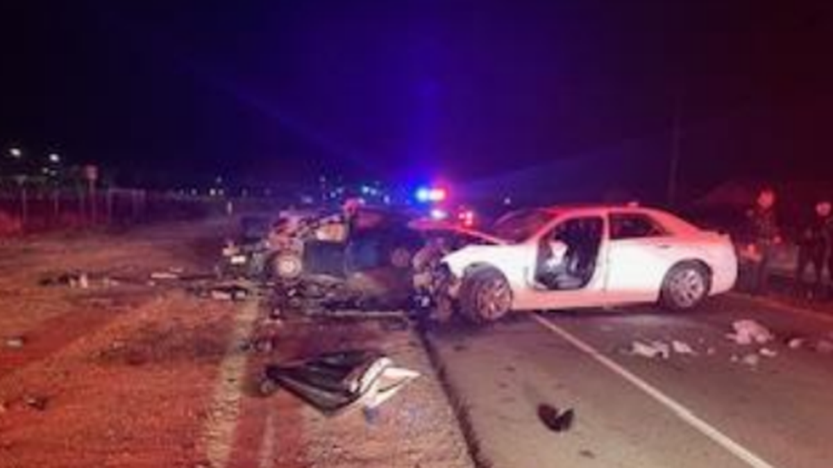 Ceres Police Department officers and the Modesto Fire Department respond to a traffic collision that killed two people and injured one near the intersection of Hatch Road and Booth Road in Ceres on Dec. 12, 2023.
