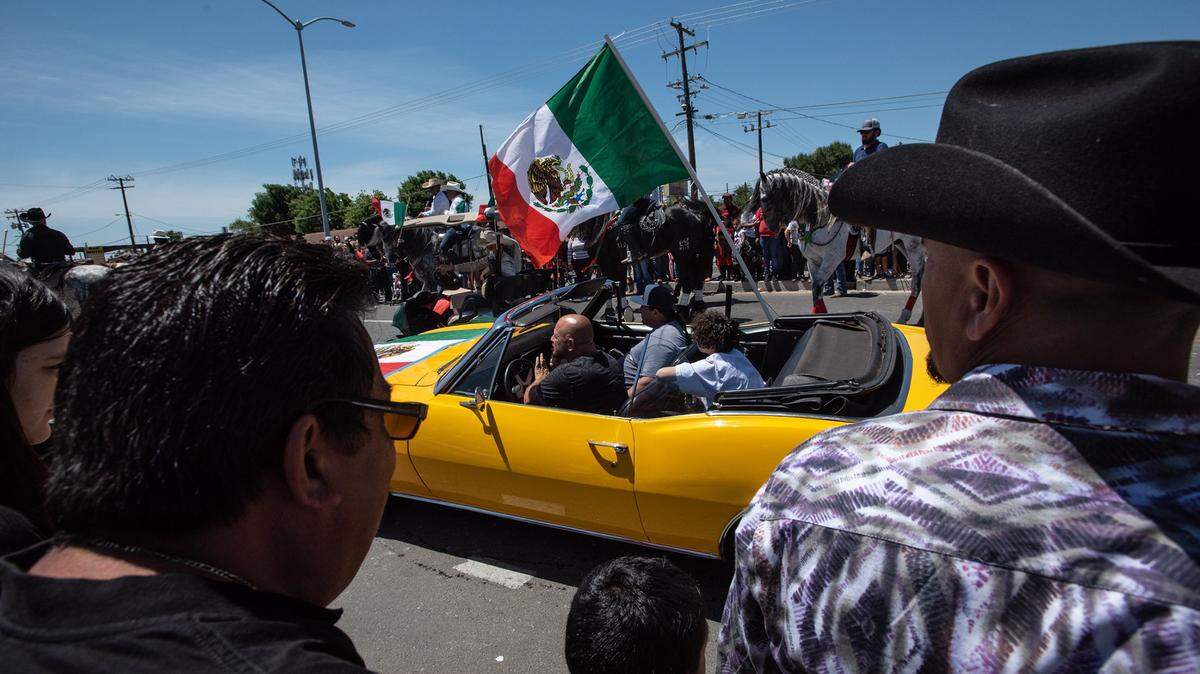 A crowd watches the 2022 Cinco de Mayo parade on Crows Landing Road in Modesto.