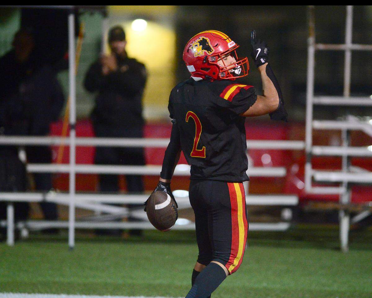 Oakdales Richard Flores (2) celebrates after scoring a touchdown during a 2024 CIF Sac-Joaquin Section Division 3 playoff game between Oakdale High School and Destiny Christian Academy at Oakdale High School in Oakdale California on November 22, 2024. Oakdale won the game 49-35.