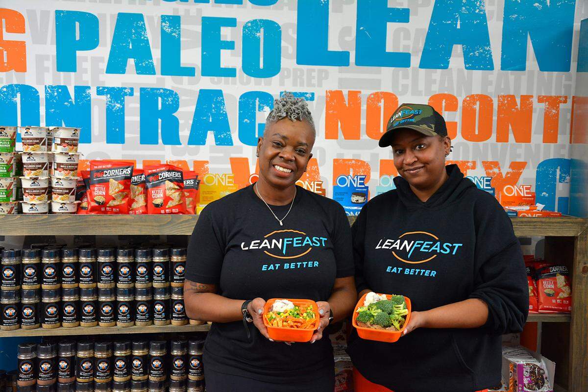 LeanFeast Modesto owner Gia Smith (left) and manager Meiska Darden inside their new meal prep business Jan. 6, 2022.