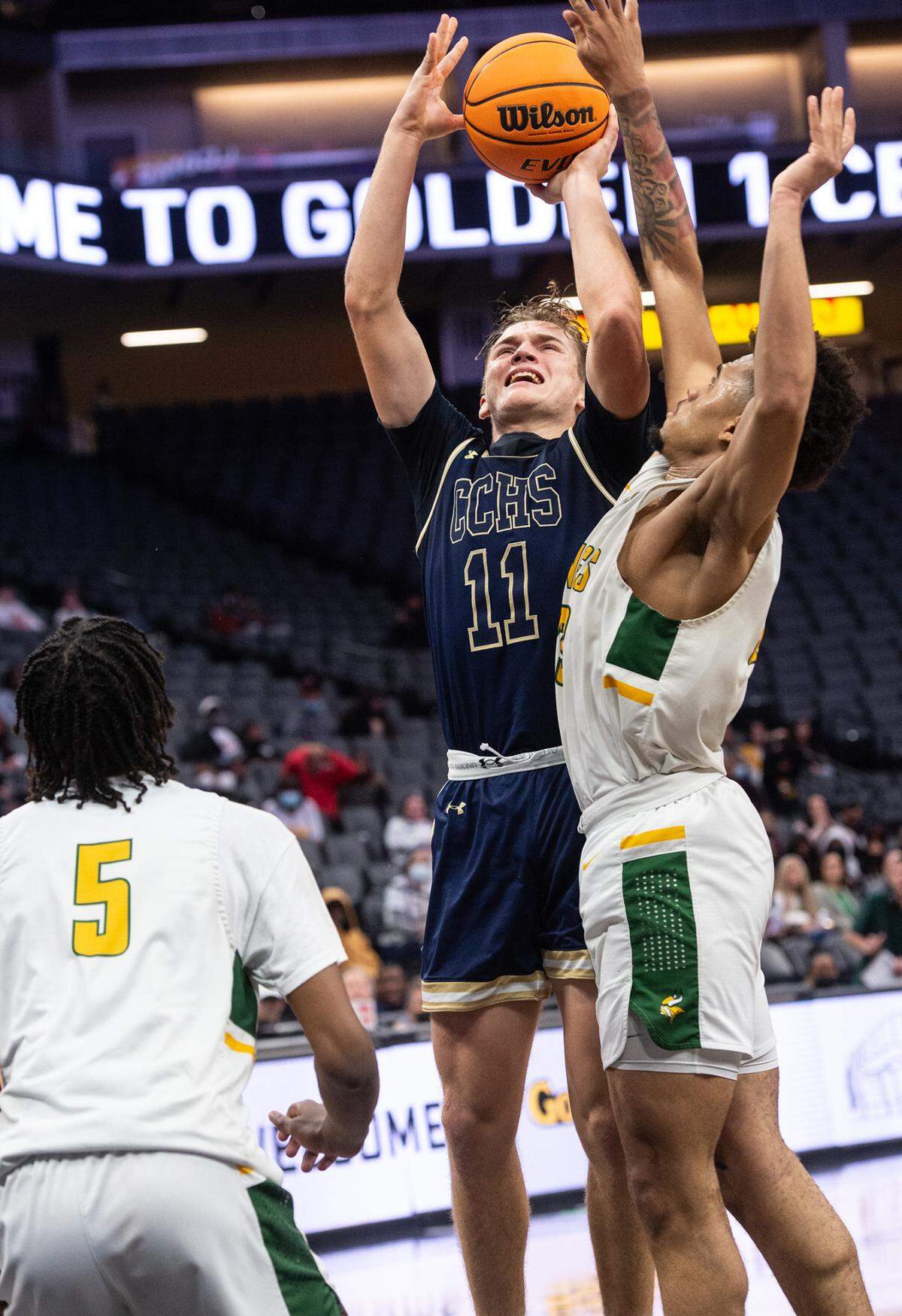 Central Catholic’s Tyler Wentworth shoots defended by Vanden’s Takai Emerson-Hardy in the boys Sac-Joaquin Section Division 3 final at the Golden 1 Center in Sacramento, Calif., on Saturday, Feb. 26, 2022.