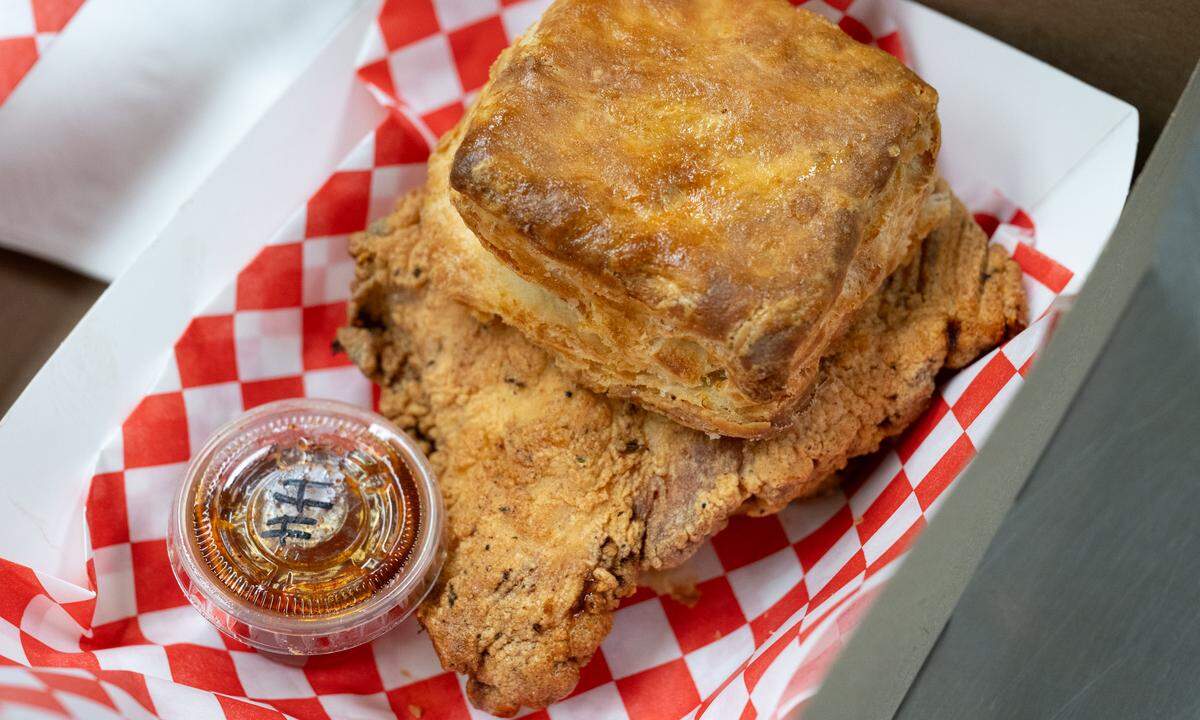 Chicken and buttermilk biscuit with hot honey sauce at Saucin’ it Up in Modesto, Thursday, June 26, 2025.