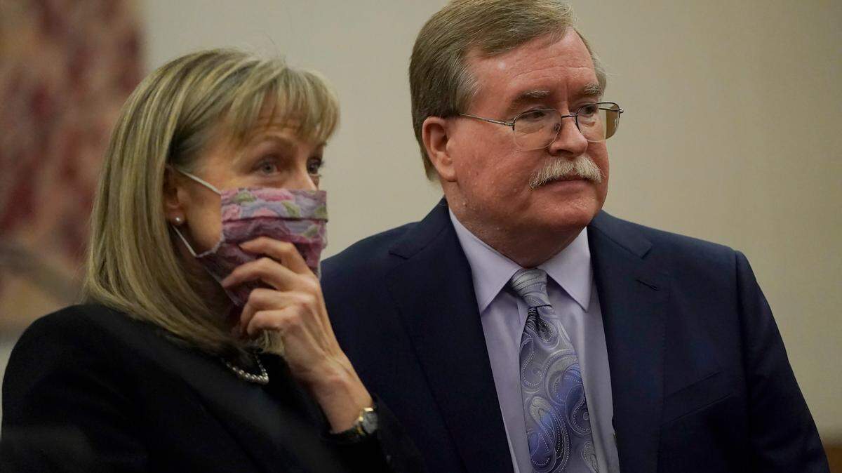 David Harris, right, and Birgit Fladager, both of the Stanislaus County District Attorney’s office, stand during a break in a hearing at San Mateo County Superior Court in Redwood City, Calif., Monday, Feb. 28, 2022. (AP Photo/Jeff Chiu, Pool)