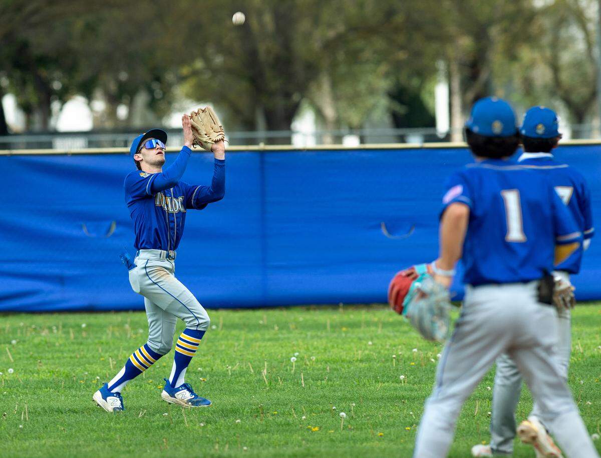 Turlock’s Carter Crivelli makes a catch in center field during the Central California Athletic league game with Downey at Downey High School in Modesto, Calif., Thursday, March 23, 2023. Turlock won the game 5-2.