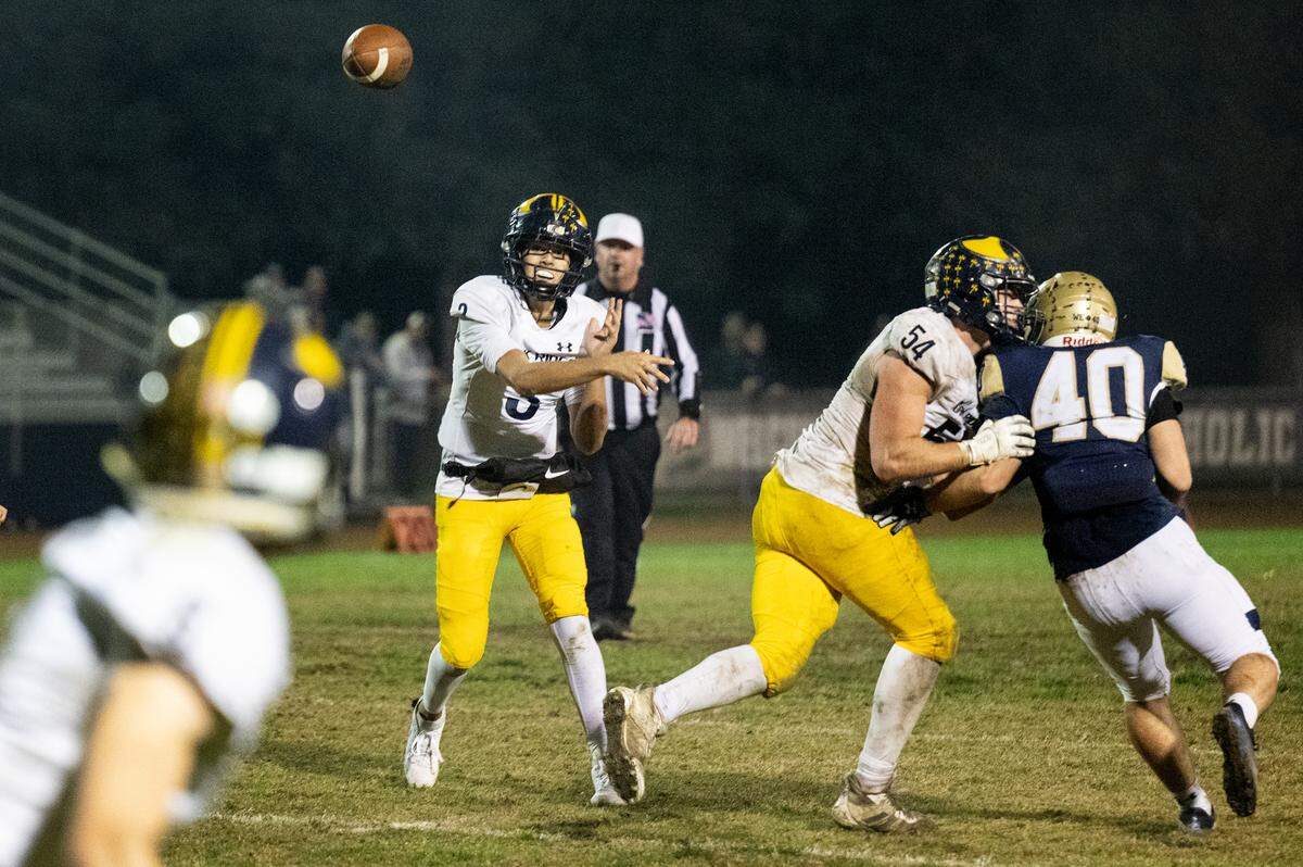 Oak Ridge quarterback Joaquin Graves-Mercado makes a pass during the Sac-Joaquin Section semifinal playoff game with Central Catholic at Central Catholic High School in Modesto, Calif., Friday Nov. 17, 2023. Oak Ridge won the game 31-14.