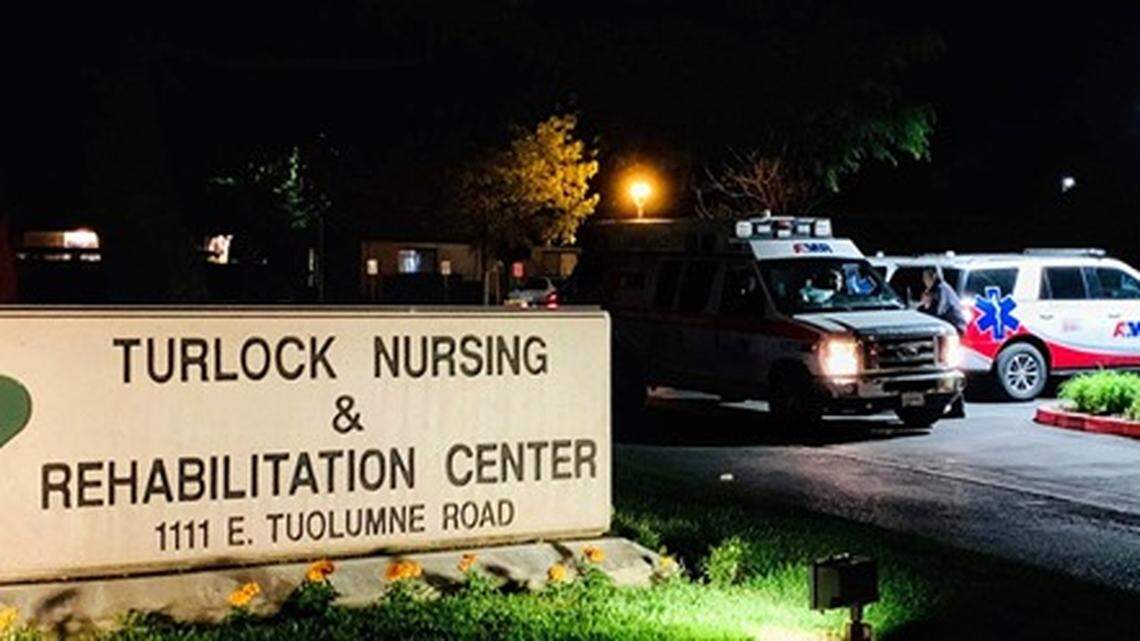 Ambulances wait outside the Turlock Nursing and Rehabilitation Center on Friday, April 24, 2020. Several employees and patients tested positive for COVID-19, according to the care facility.