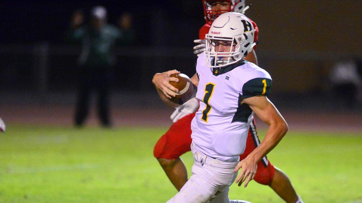 Hilmar quarterback Ryan Texieira (1) cuts upfield on a scramble during a game between Ripon and Hilmar at Ripon High School in Ripon CA on September 14, 2018.

