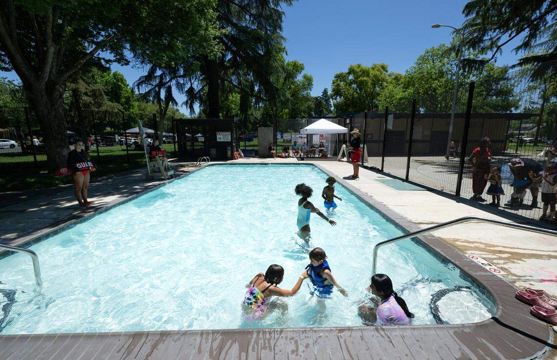 Children keep their cool at the Graceada Park wading pool in Modesto, Calif., on Saturday, June 15, 2024. 