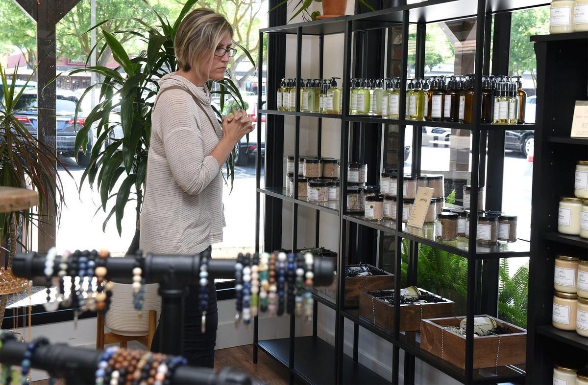 Whitney Mize shops at Mobaak Aromatherapy Shoppe on Tuesday morning May 7, 2019 in Roseburg Square in Modesto, Calif.