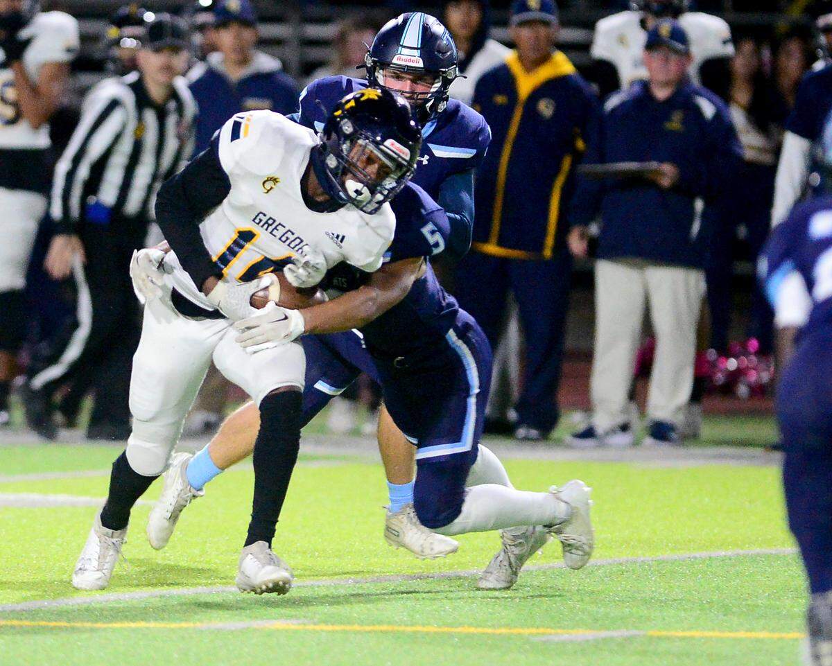 Gregori receiver Reggieon Foster (14) tries to turn up the field after catching a pass during a game between Downey and Gregori at Downey High School in Modesto, California on October 27, 2023.