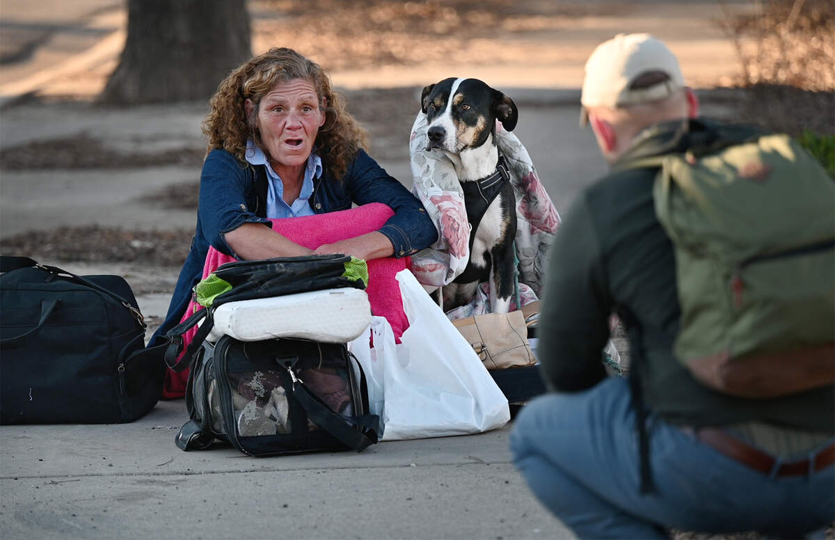 Julie Portman talks with volunteer Joe Homer during the annual count of Stanislaus County’s homeless in Modesto, Calif., on Thursday, Feb. 24, 2022. The U.S. Department of Housing and Urban Development requires local communities to conduct the annual point-in-time count to receive homeless funding.