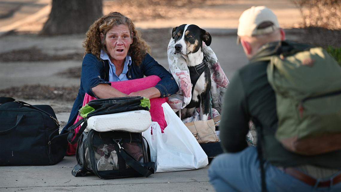 Julie Portman talks with volunteer Joe Homer during the annual count of Stanislaus County’s homeless in Modesto, Calif., on Thursday, Feb. 24, 2022. The U.S. Department of Housing and Urban Development requires local communities to conduct the annual point-in-time count to receive homeless funding.