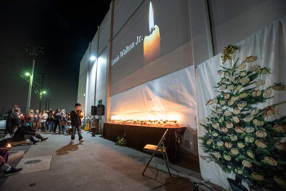 Candles are lit during the annual Modesto vigil honoring people who died while experiencing homelessness in Stanislaus County. The vigil remembered those who died in both 2020 and 2021 during a ceremony at The Salvation Army Berberian Shelter in Modesto, Calif., on Tuesday, Dec. 21, 2021. The event occurred on National Homeless Persons’ Memorial Day, which marks the winter solstice and longest night of the year.