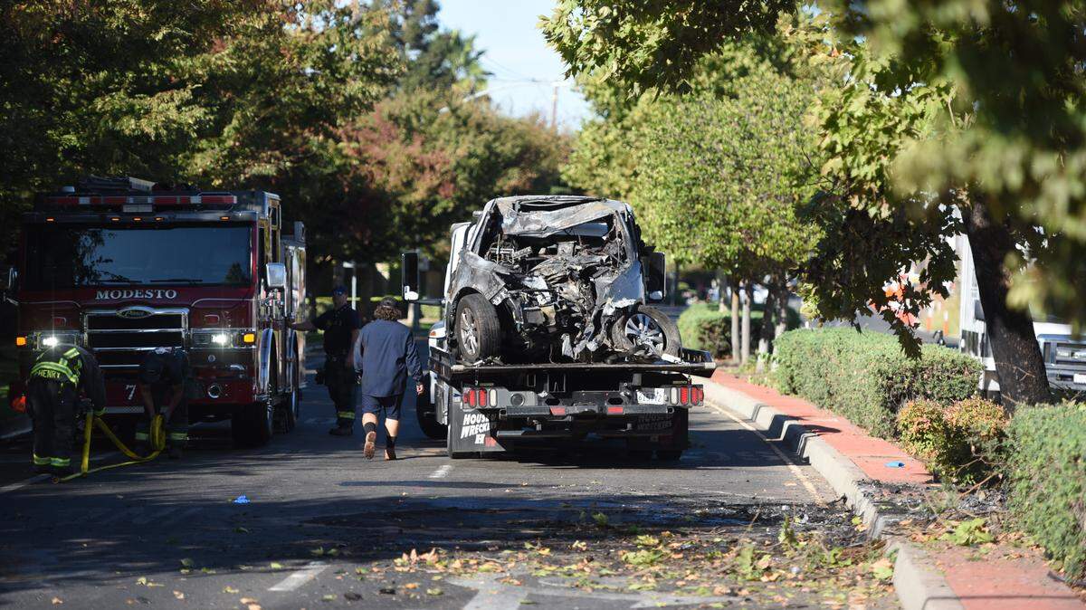 A tow truck hauls away a vehicle that crashed on Sylvan Avenue in Modesto early Tuesday morning, Sept. 30, 2025. Police said the driver died at the scene.